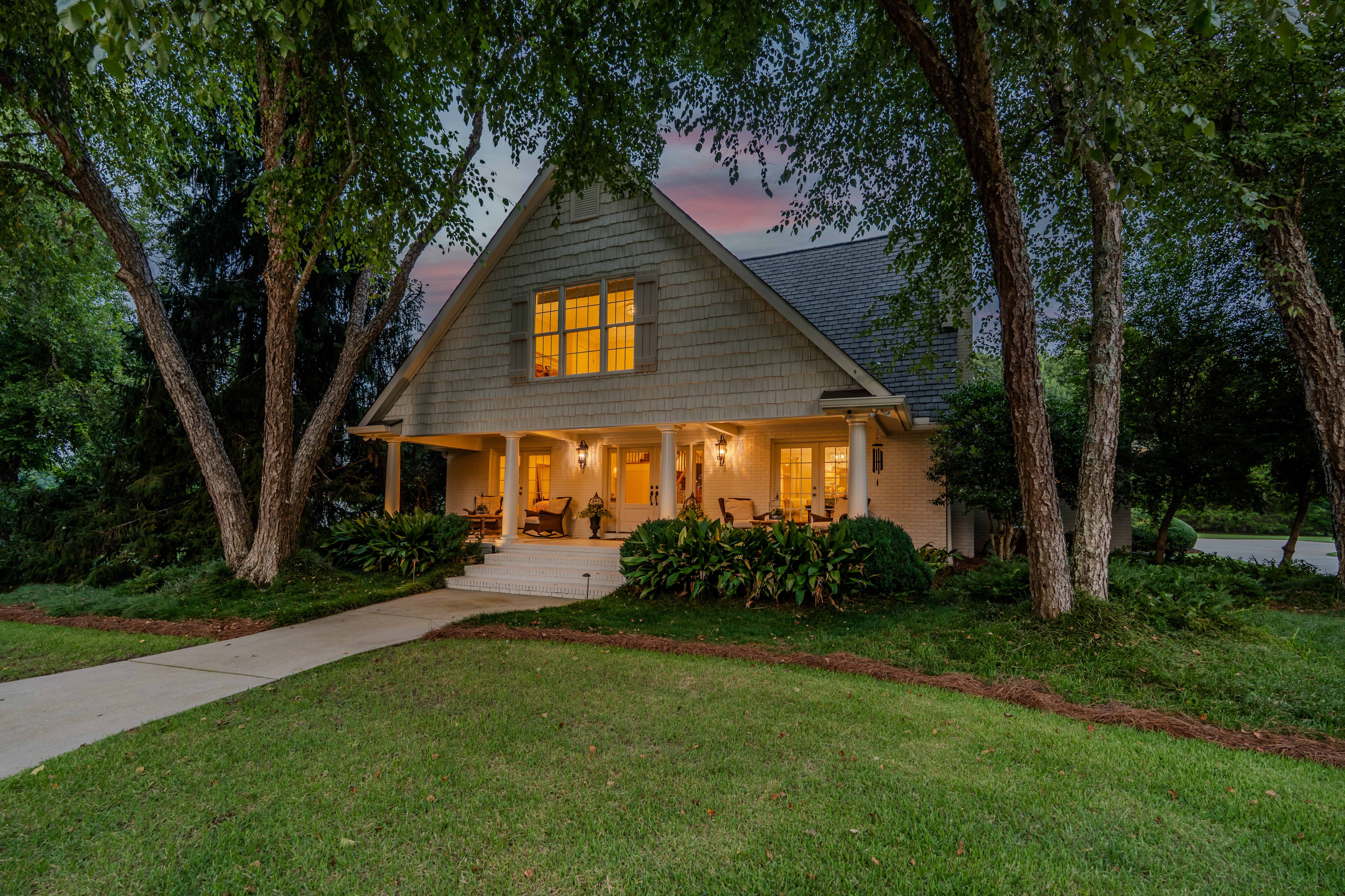 Hummingbird Manor at dusk, seen from the circular drive