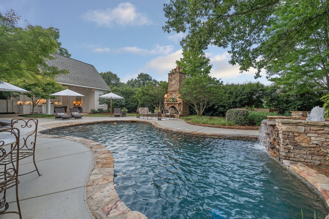 Across the pool to the stone fireplace